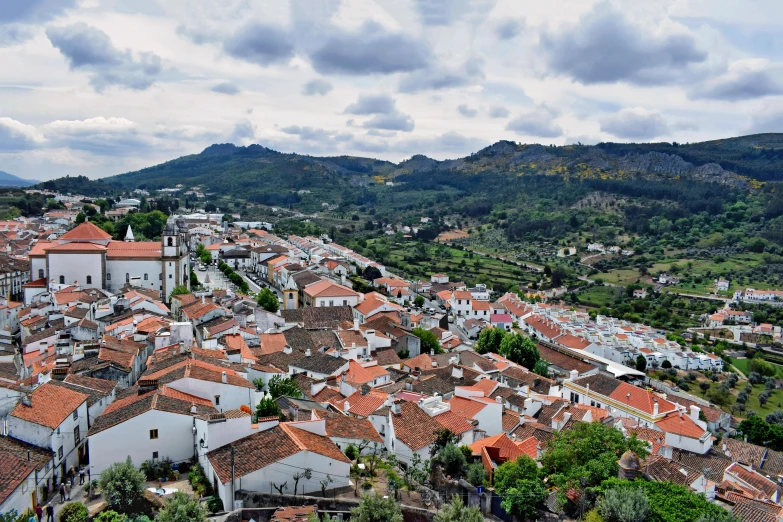 a view of a town from the top of a hill, seu madruga, promo image, profile image, thumbnail