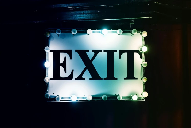 a close up of a lit up exit sign, an album cover, pexels, ignant, nightclub, emily rajtkowski, reuniting