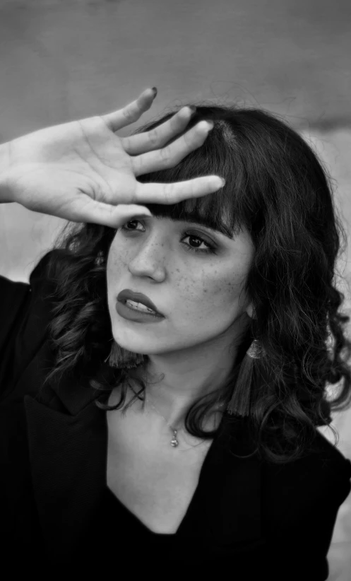 a black and white photo of a woman with her hands on her head, an album cover, realism, rebecca sugar, rosalia vila i tobella, lipstick, headshot profile picture