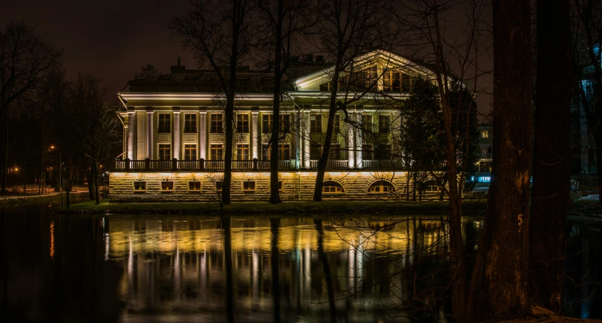 a large building sitting next to a body of water, by Serhii Vasylkivsky, outdoors lighting, classicism style, nature photo, thumbnail