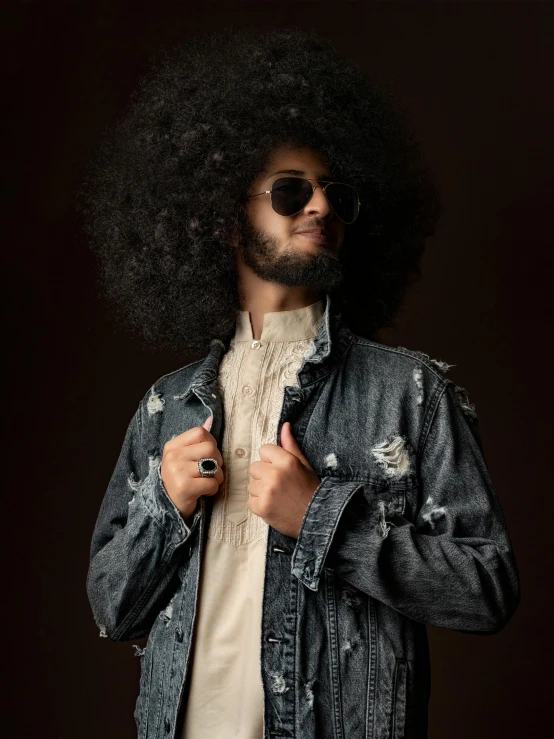 a man with an afro wearing a denim jacket, pexels contest winner, wearing a fancy black jacket, promo image, sam nassour, taken in the early 2020s