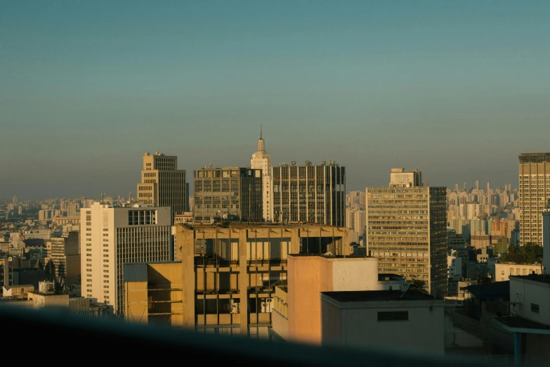 a view of a city from the top of a building, by Elsa Bleda, pexels contest winner, brutalism, henrique alvim corrêa, late afternoon, slide show, low-angle