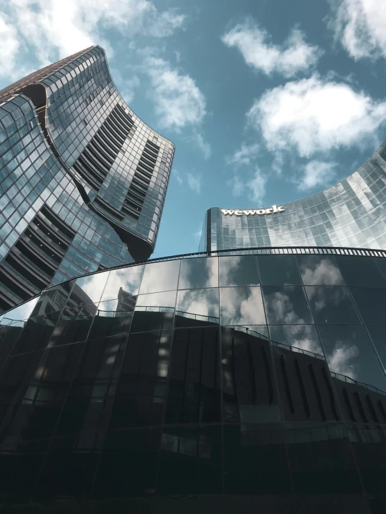 some very tall buildings in a big city, inspired by Zaha Hadid, unsplash contest winner, futuristic casino, gopro photo, with shiny glass buildings, seen from outside