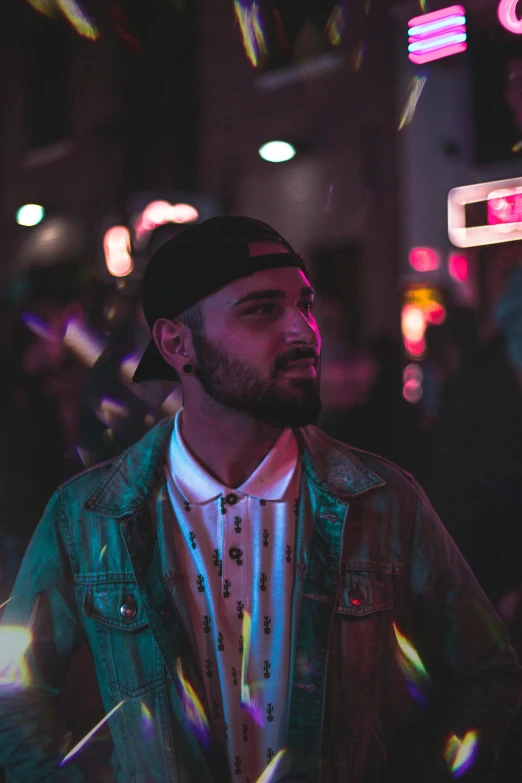 a man standing in the middle of a street at night, an album cover, pexels contest winner, smug look, riyahd cassiem, bisexual lighting, profile pic