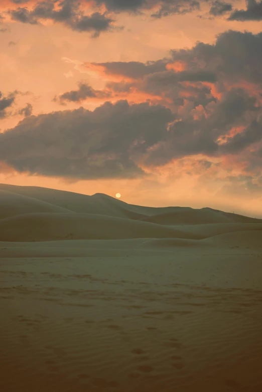 a person riding a horse in the desert, an album cover, inspired by Frederick Goodall, flickr, ((sunset)), snow dunes, serene colors, may)