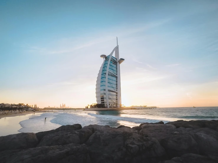 the burj al arab burj al al al al al al al al al al al al al al al al al al al, pexels contest winner, golden hour 4k, youtube thumbnail, in a beachfront environment, tall building