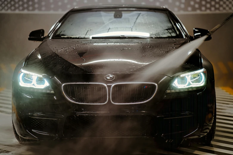 a car being washed with a high pressure washer, pexels contest winner, photorealism, bmw, dramatic lighting 4k, intense face, black car