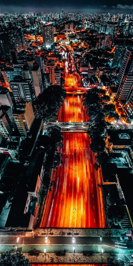 an aerial view of a city at night, an album cover, by Alejandro Obregón, unsplash contest winner, highway to hell, sao paulo in the year 2 0 7 0, japanese city, tourist photo