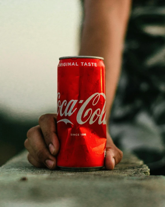 a person holding a can of coca cola, pexels contest winner, fan favorite, lgbtq, cocaine, 6 pack