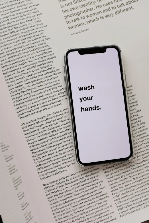 a cell phone sitting on top of an open book, trending on pexels, graffiti, commercial washroom hand dryer, unsplash transparent, 2 5 6 x 2 5 6, wash