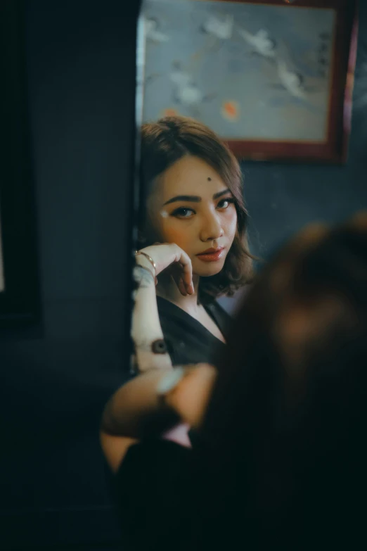 a woman that is standing in front of a mirror, a picture, inspired by Elsa Bleda, trending on pexels, realism, malaysian, small eyebrows, concert, girl with brown hair