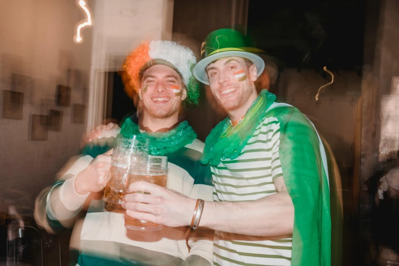 a couple of men standing next to each other, a polaroid photo, pexels contest winner, renaissance, green visor, beer, fancy dress, striped