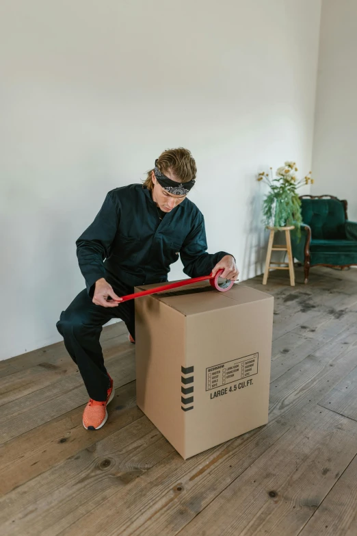 a man sitting on top of a cardboard box, spoon placed, profile image, blindfolded, inspect in inventory image