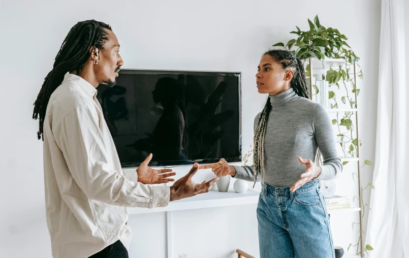 a man and woman standing in front of a flat screen tv, trending on pexels, visual art, arguing, diverse, on a coffee table, charli bowater and artgeem