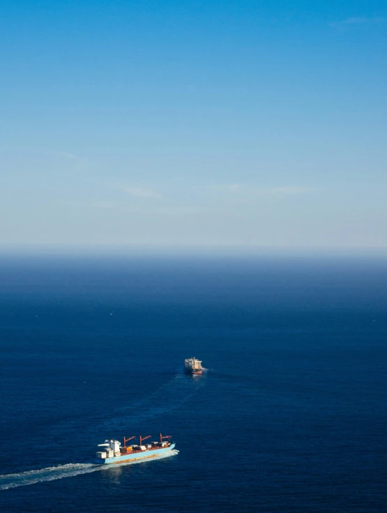 a couple of boats that are in the water, a tilt shift photo, pexels contest winner, minimalism, crossing the blue horizon, big graphic seiner ship, print ready, mediterranean