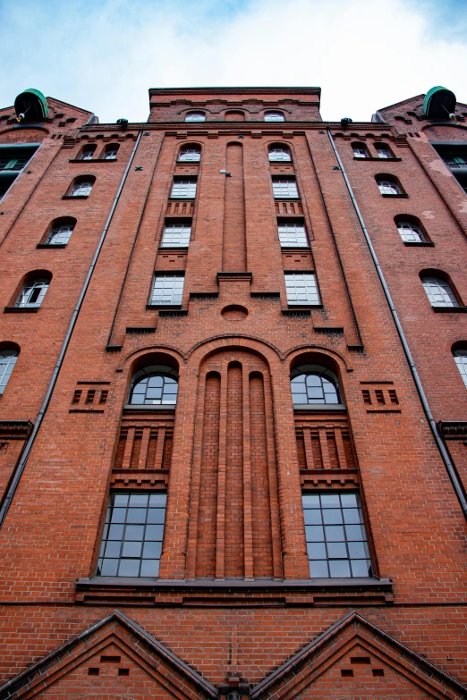 a tall red brick building with lots of windows, inspired by Adolf Hölzel, warehouse, astonishing detail