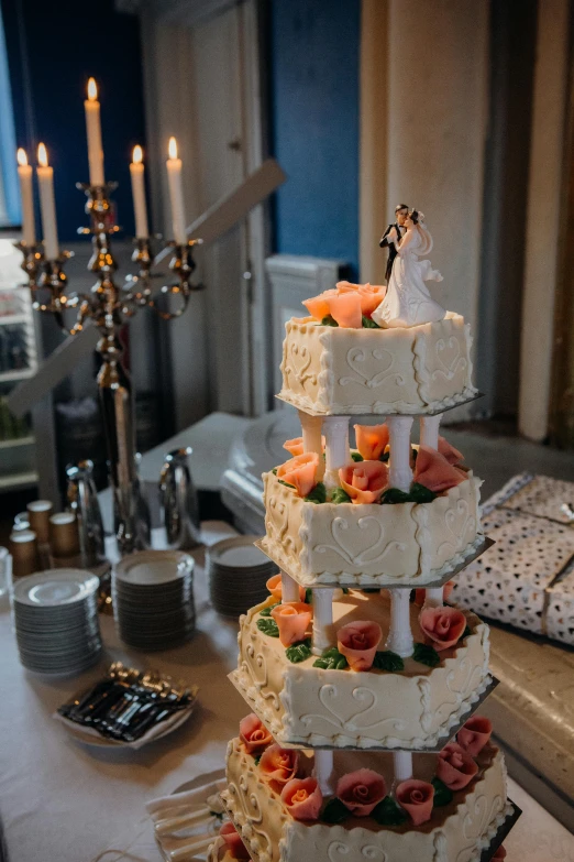 a wedding cake sitting on top of a table, in the evening, belgium, fully decorated, paul barson