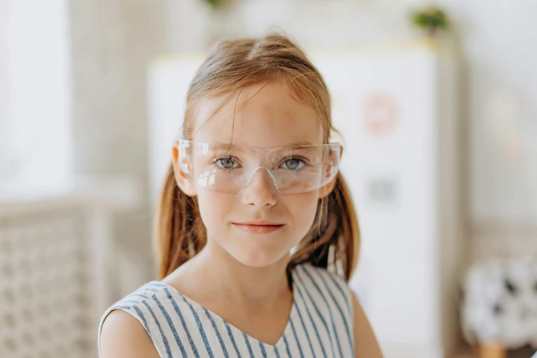 a little girl wearing a pair of safety glasses, pexels contest winner, stood in a lab, portrait of a young teenage girl, educational, young girls