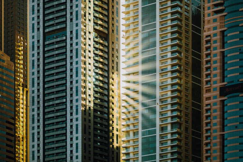 a group of tall buildings next to each other, pexels contest winner, hyperrealism, shafts of light, 2000s photo, mixed development, light shadows