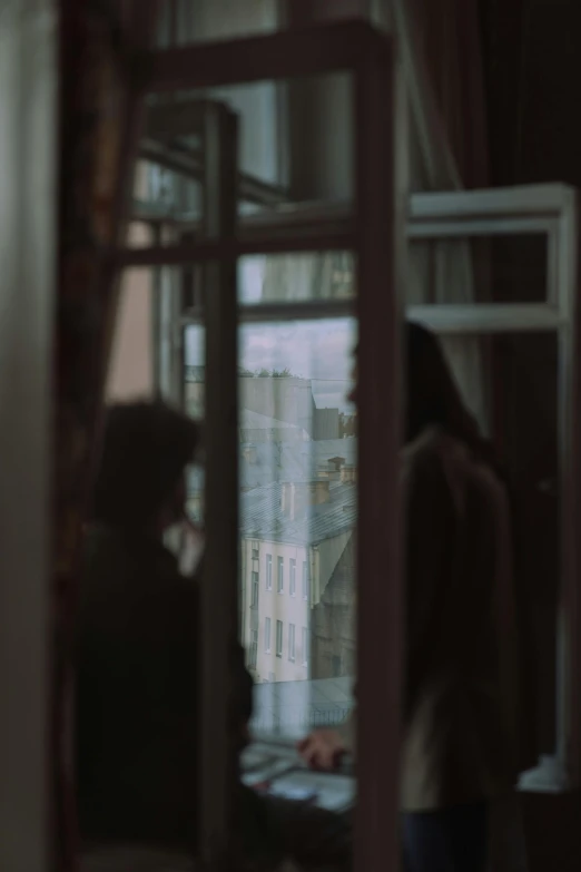a couple of people standing in front of a window, a picture, inspired by Elsa Bleda, pexels contest winner, tonalism, panoramic view of girl, paris hotel style, andrei tarkovsky scene, :: morning