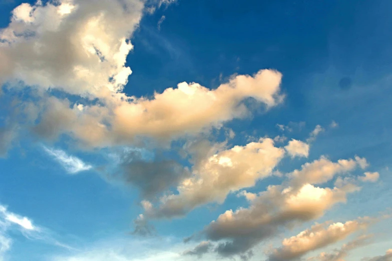 a man flying a kite on top of a lush green field, layered stratocumulus clouds, blue - yellow sky, colour photograph, today\'s featured photograph 4k