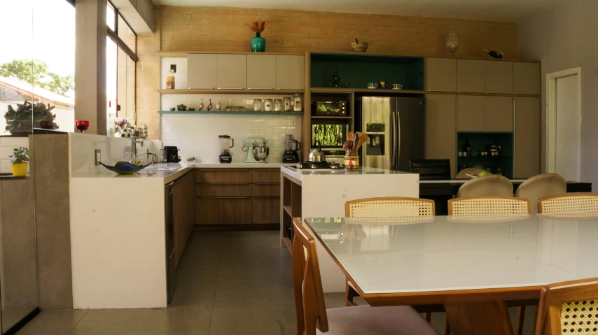 a kitchen with a table and chairs in it, pexels contest winner, vastayan, sustainable materials, full shot, cabinets