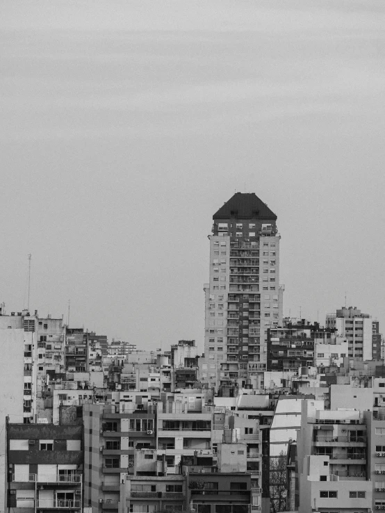 a black and white photo of a city, by Luis Molinari, unsplash, brutalism, buenos aires, damascus, tall and small, ilustration