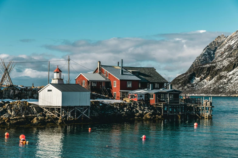 a boat sitting on top of a body of water, by Christen Dalsgaard, pexels contest winner, hurufiyya, small buildings, small port village, 🦩🪐🐞👩🏻🦳, sunny light