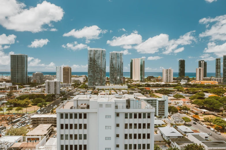 a large white building in the middle of a city, by Carey Morris, unsplash contest winner, hawaii, 8 k. filling of the view, three views, fallout 5 : miami