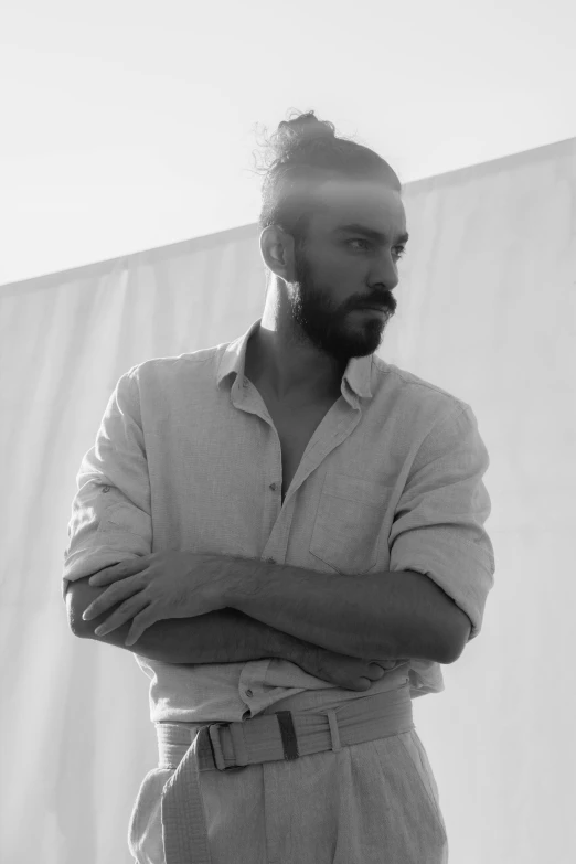 a black and white photo of a man with a beard, by Giorgio Cavallon, wearing a linen shirt, zac retz, show, large)}]