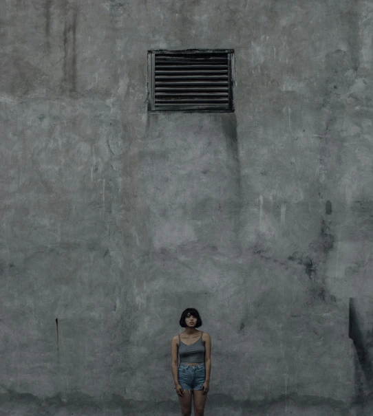 a woman standing in front of a concrete wall, pexels contest winner, postminimalism, vents, portrait of small, ( conceptual art ), full body within frame