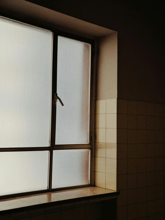 a toilet sitting next to a window in a bathroom, an album cover, inspired by Elsa Bleda, trending on vsco, window ( city ), condensation, background image