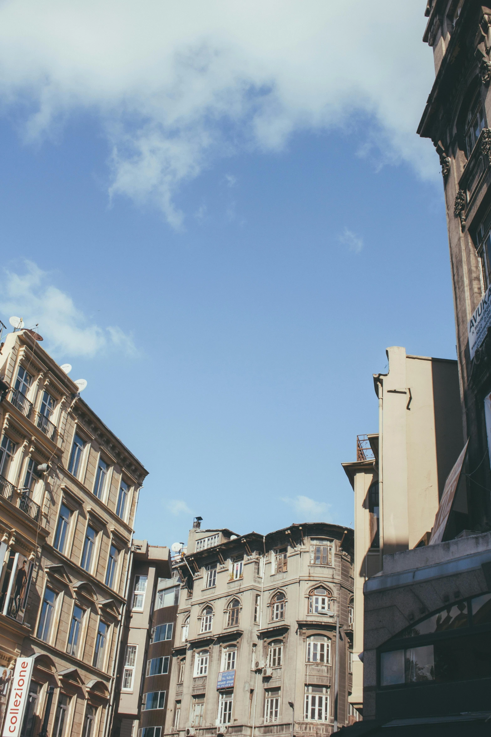 a clock that is on the side of a building, by Nina Hamnett, trending on unsplash, renaissance, clear blue skies, glasgow, center of picture, tenement buildings