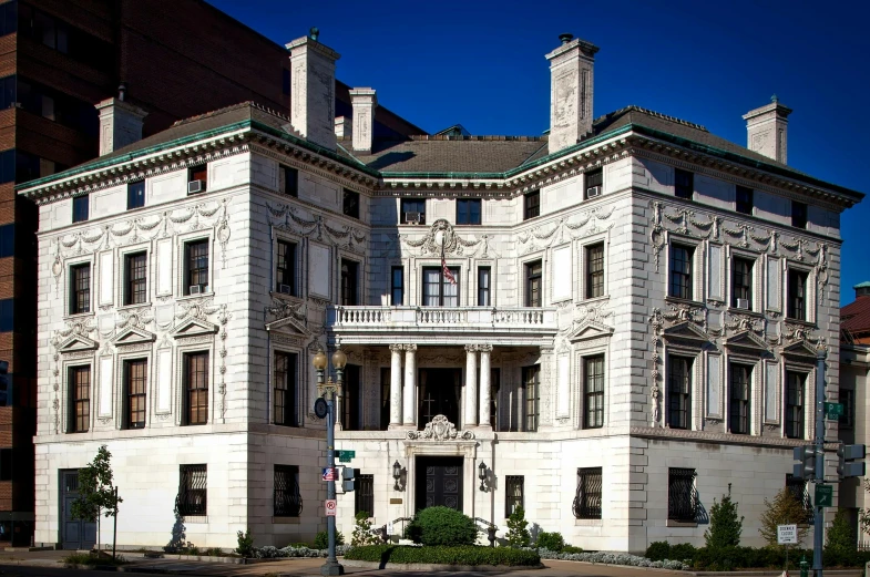 a large white building sitting on the side of a road, a photo, flickr, art nouveau, mansion, smithsonian american art museum, square, 8k resolution”