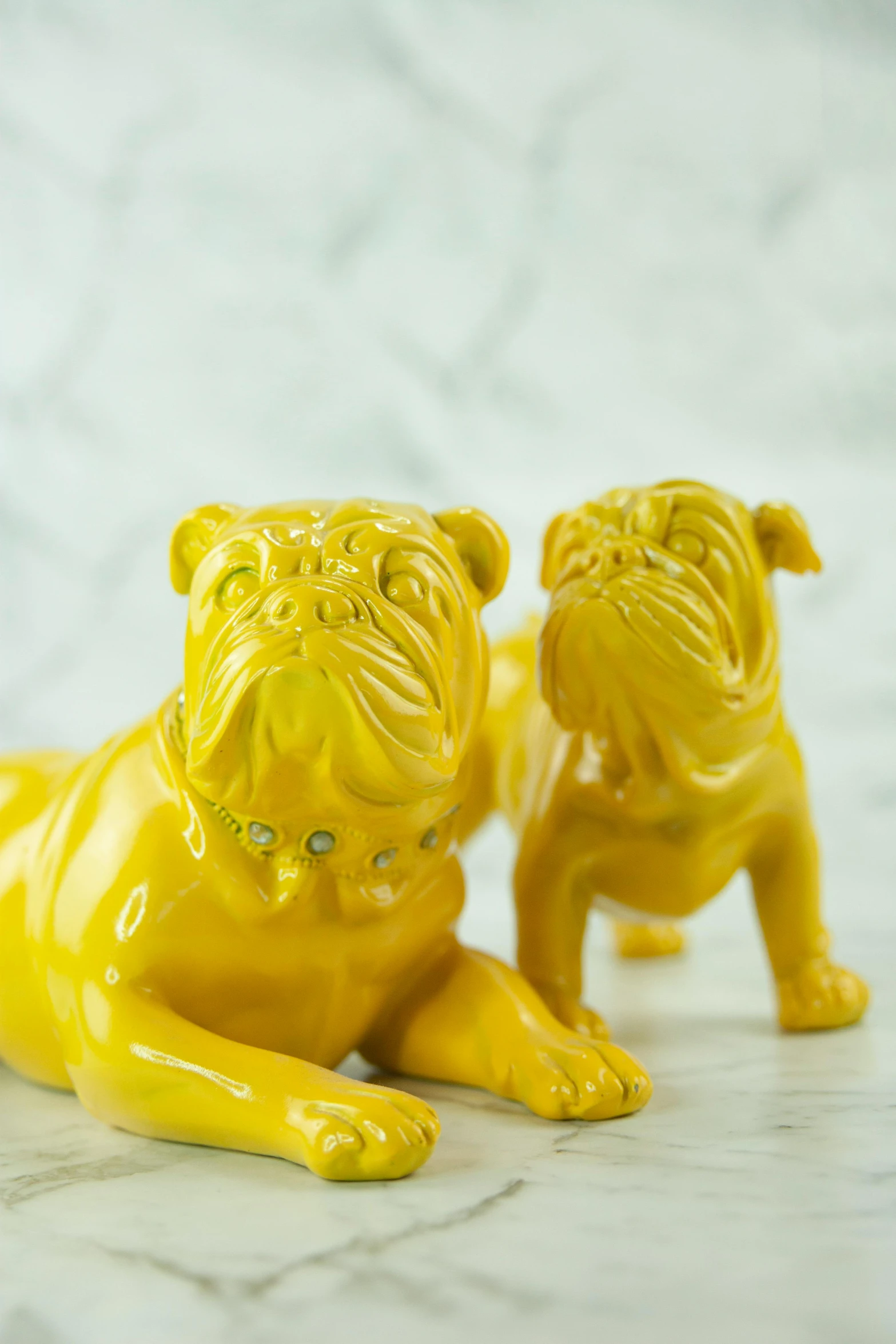 two yellow dog figurines sitting next to each other, inspired by Frank O'Meara, lavish, gloss, laying on their back, vintage inspired