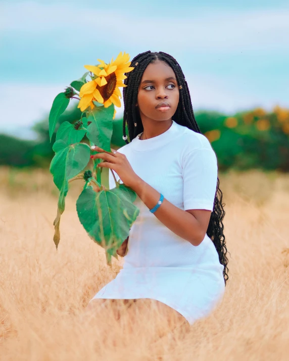 a woman kneeling in a field holding a sunflower, an album cover, by Stokely Webster, pexels contest winner, visual art, black teenage girl, ☁🌪🌙👩🏾, a beautiful woman in white, white braids