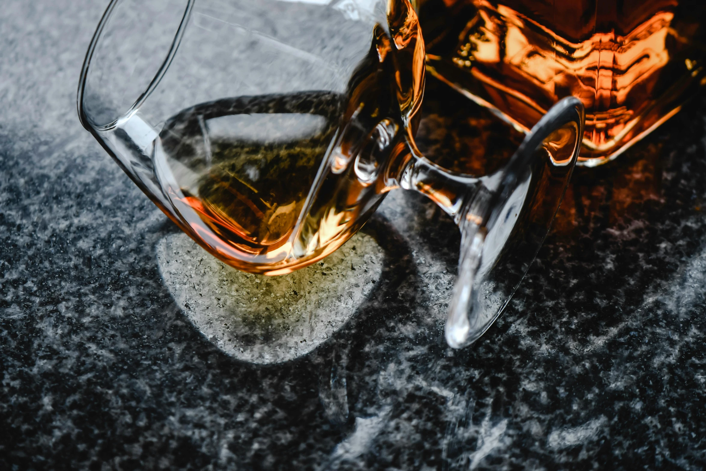 a glass of whiskey sitting on top of a table, pexels contest winner, renaissance, bending down slightly, avatar image, high angle close up shot, stone and glass