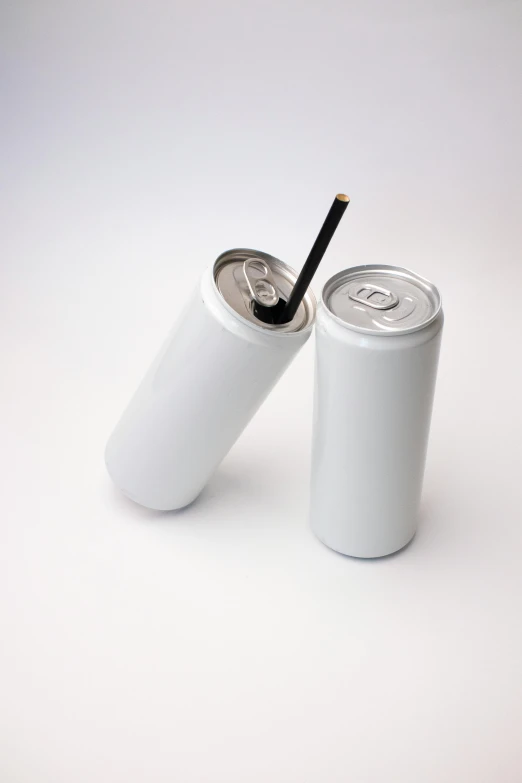 a couple of soda cans sitting next to each other, unsplash, photorealism, with a straw, 'white background'!!!, hungover, no - text no - logo