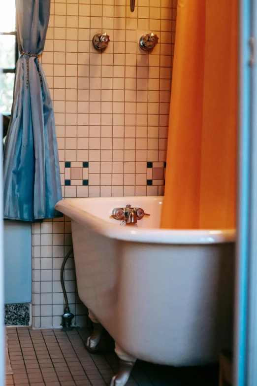 a white bath tub sitting in a bathroom next to a window, by Jessie Algie, renaissance, tiles curtains, ballard, barbara canepa, blue