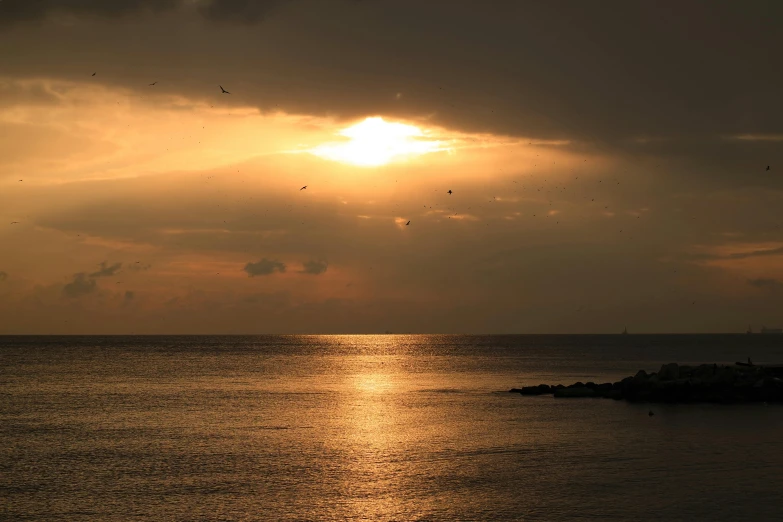 the sun is setting over a body of water, a picture, pexels contest winner, romanticism, japan shonan enoshima, brown, dramatic light 8 k, 2022 photograph