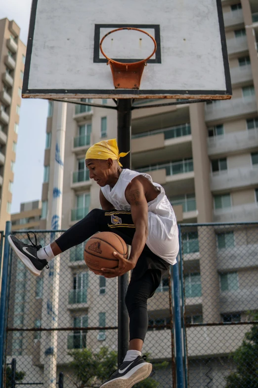 a man flying through the air while holding a basketball, trending on dribble, in sao paulo, hiphop urban inspired, looking sad, 2019 trending photo