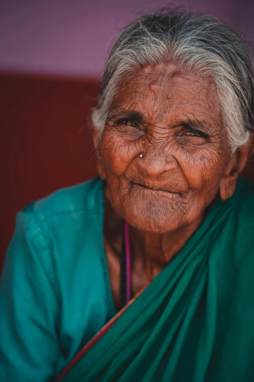 an old woman with a big smile on her face, an album cover, pexels contest winner, sri lanka, wrinkled skin, very pretty face, unsplash photo contest winner