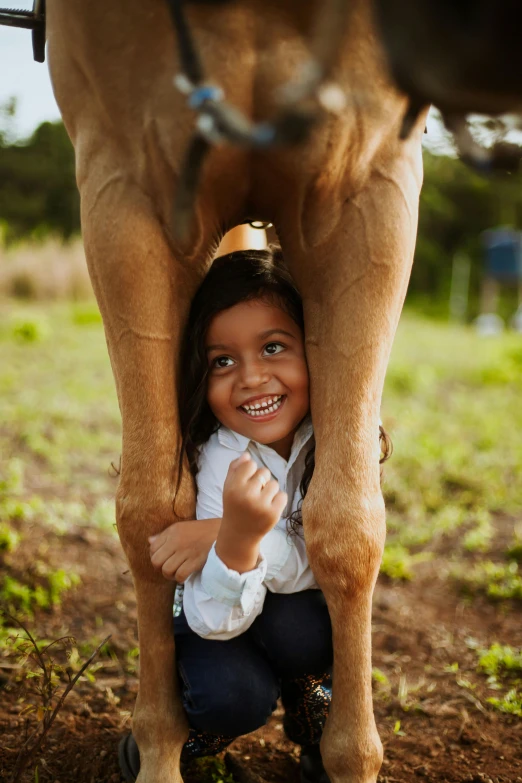 a little girl standing next to a cow, by Elizabeth Durack, pexels contest winner, horse is up on its hind legs, hispanic, at a park, organic detail