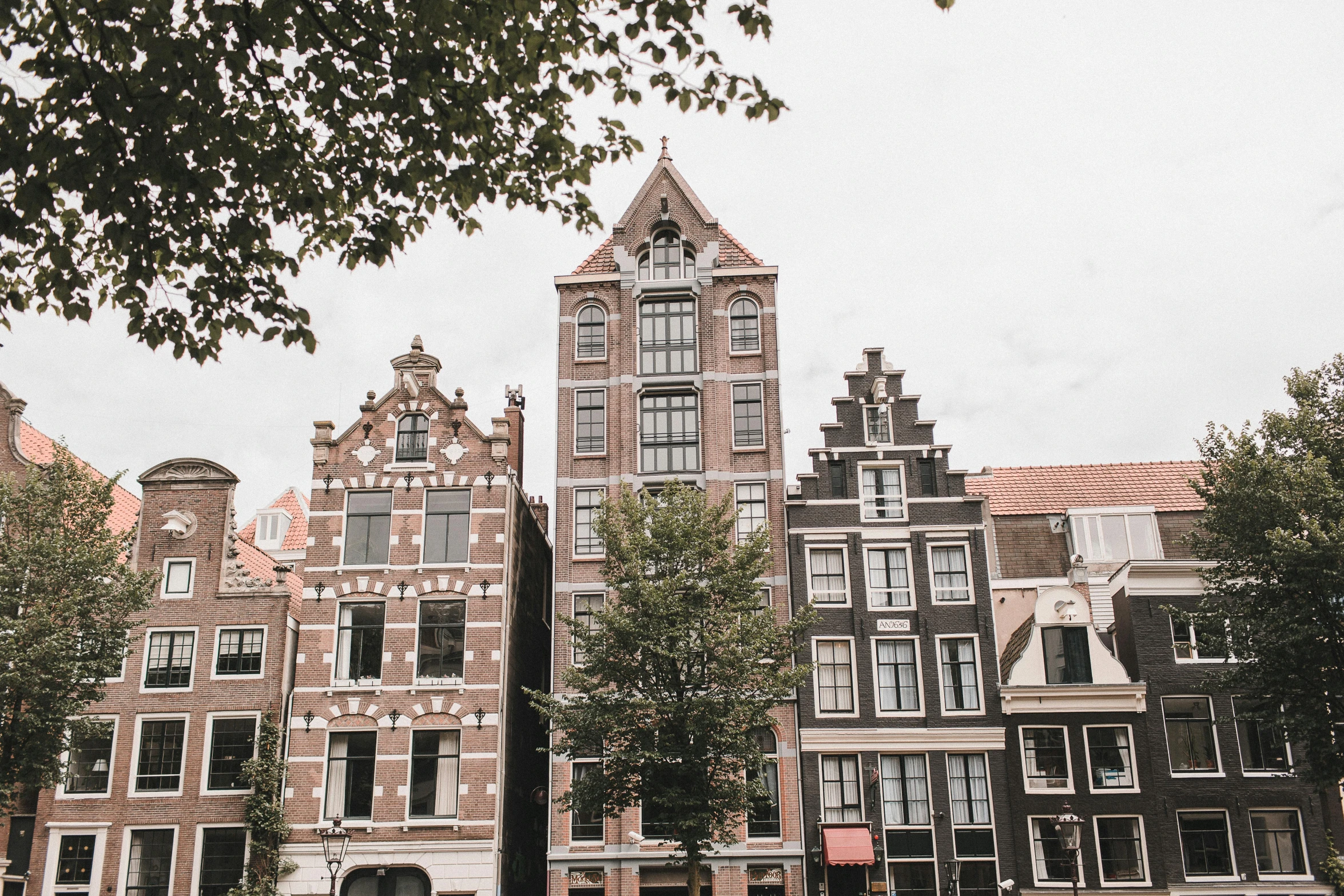 a bunch of buildings that are next to each other, by Jan Tengnagel, pexels contest winner, art nouveau, dutch style, 🦩🪐🐞👩🏻🦳, a quaint, rem koolhaas