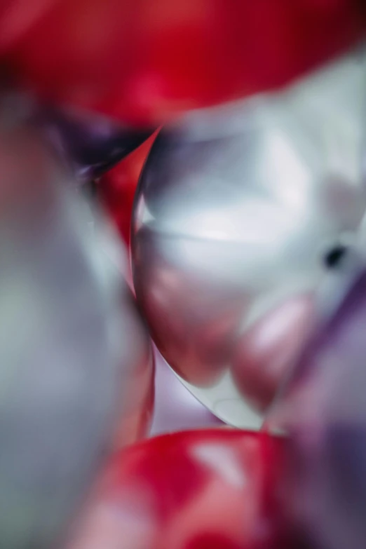 a close up of a bunch of balloons, by Doug Ohlson, abstract art, silver red, color ( sony a 7 r iv, made of silk paper, pearlescent