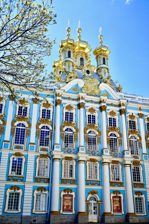 a blue and white building with a clock tower, inspired by Fyodor Alekseyev, rococo, golden windows, 2 5 6 x 2 5 6 pixels, up-close, delightful surroundings