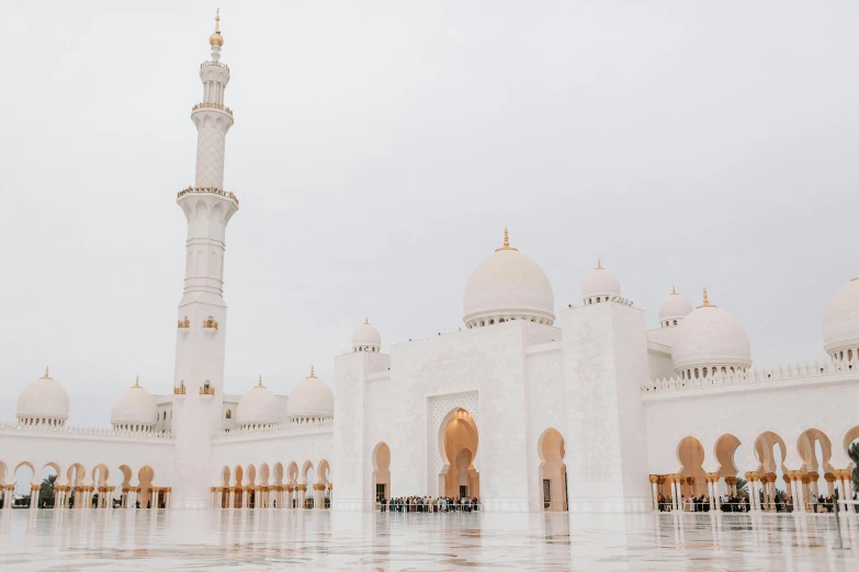 a group of people standing in front of a white building, a marble sculpture, by Julia Pishtar, pexels contest winner, hurufiyya, with beautiful mosques, arab inspired, white and gold, building facing