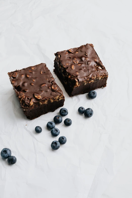 a couple of brownies sitting on top of a table, blueberries on the side, detailed product image, seattle, thumbnail