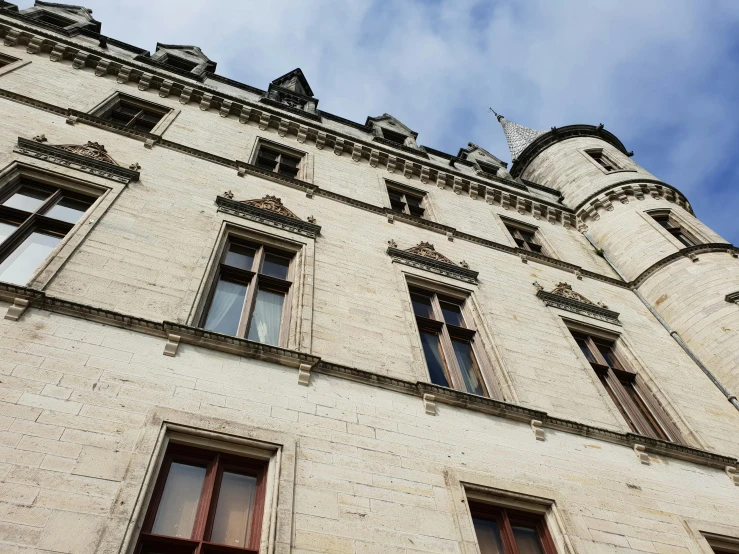 a tall building with a clock on top of it, an album cover, inspired by Albert Guillaume, unsplash, rennes - le - chateau, limestone, exterior view, thumbnail