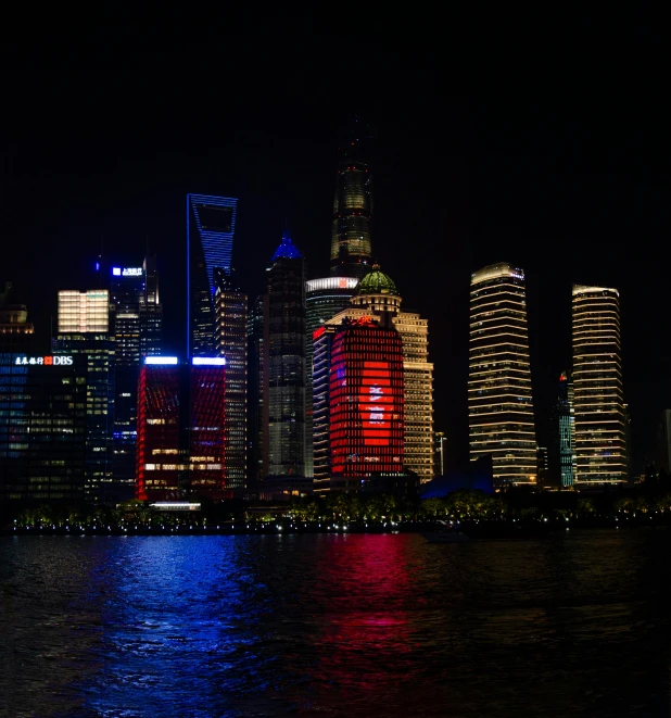 a view of a city at night from across the water, an album cover, inspired by Cheng Jiasui, pexels contest winner, red leds, panorama view, photo taken from a boat, shot with sigma f/ 4.2